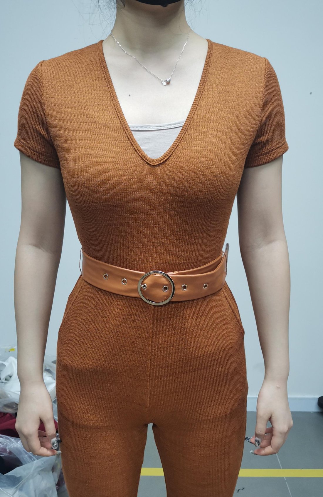 Ribbed knit top and flare trouser set with belt, front detail