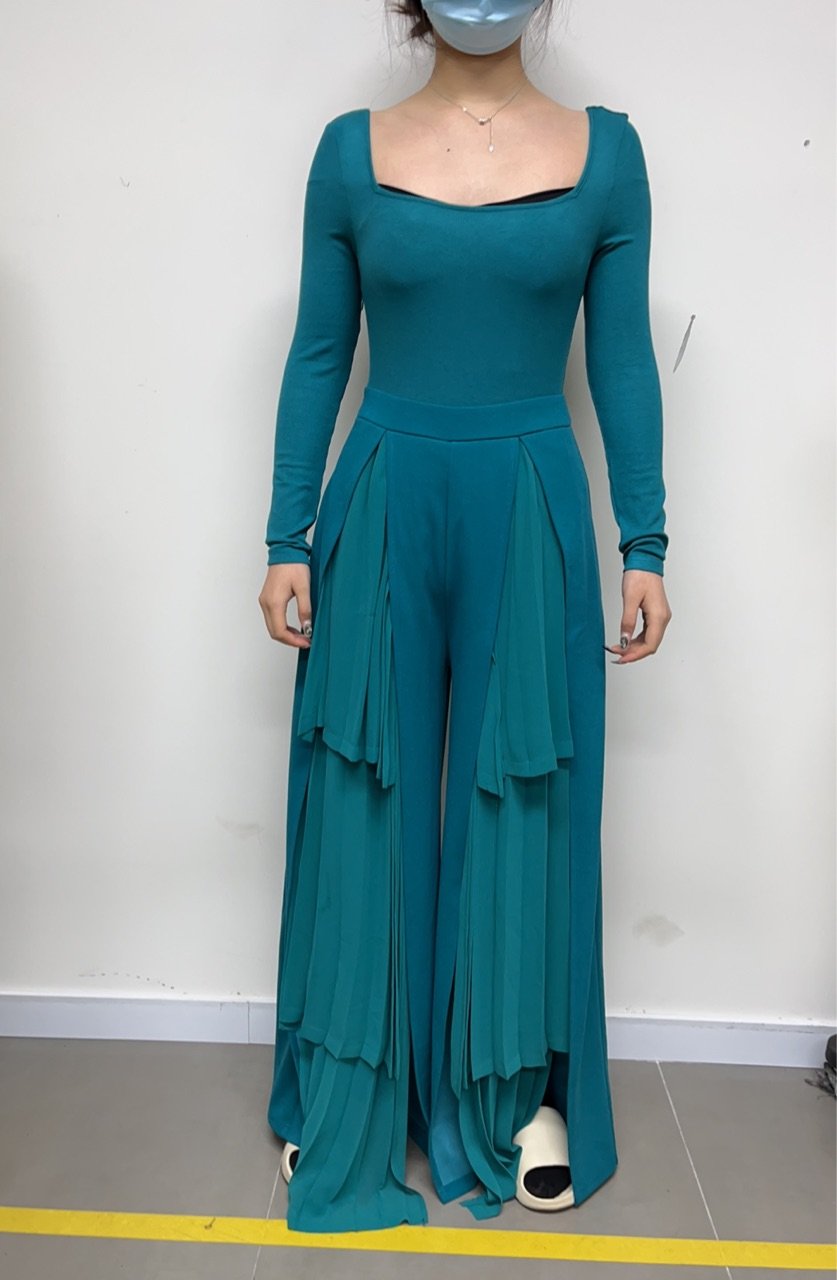 Long-sleeve jumpsuit with tiered ruffle pants, front view