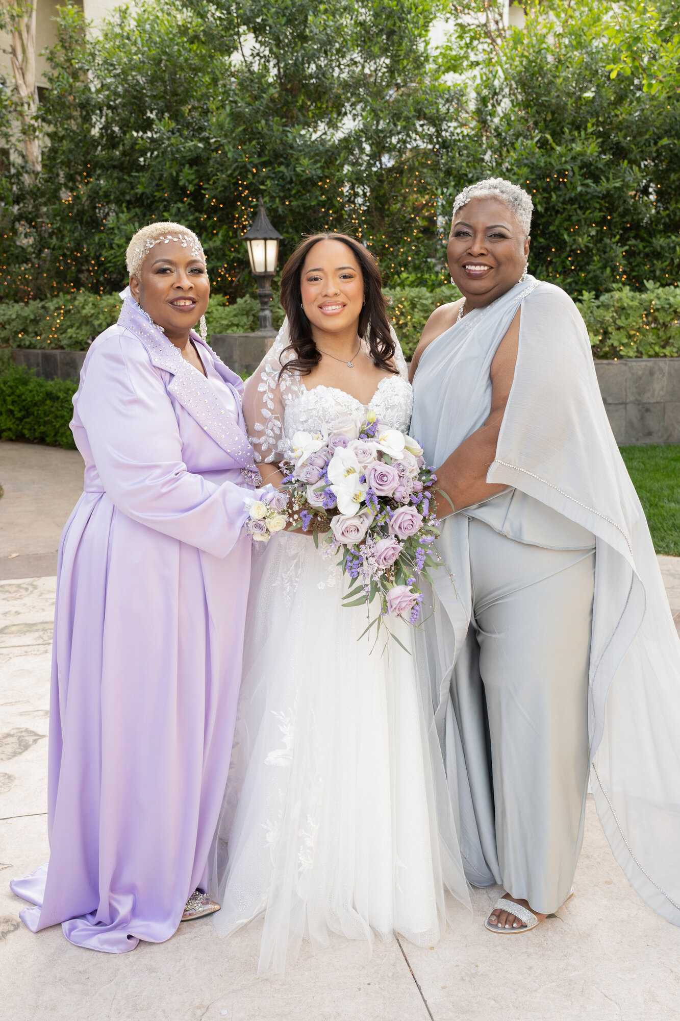 Custom mother-of-the-bride and mother-of-the-groom looks, a lavender beaded coat-dress and a draped cape jumpsuit