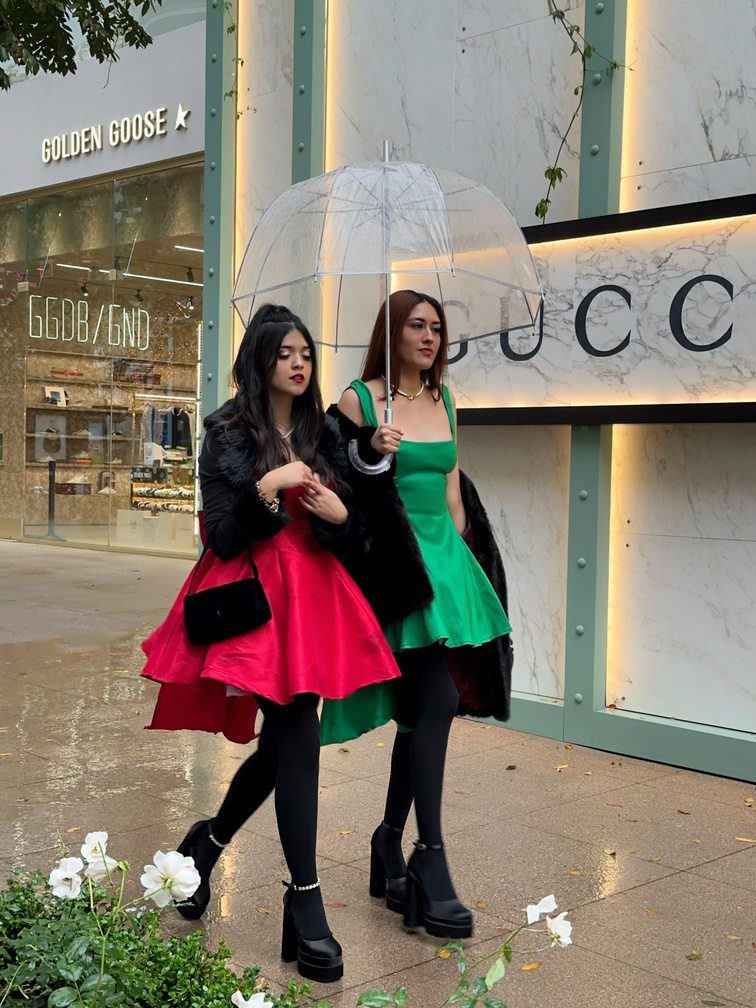 Custom red gown, front view, styled with the custom green gown at The Americana at Brand